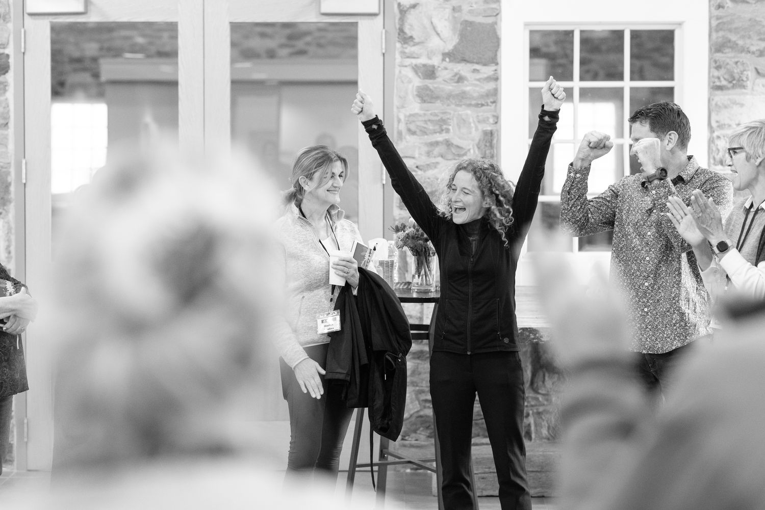 Amy celebrating with a group after a gathering